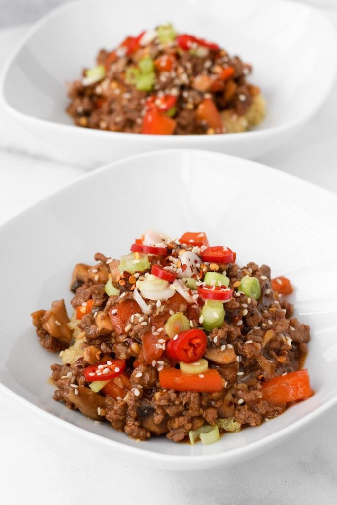 These healthy bowls feature a quinoa or rice base topped with a soy-chili-garlic spiced beef and vegetable mixture. They are gluten-free, dairy-free, and flavour-packed!