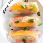 These gluten-free, dairy-free, and vegan homemade summer rolls are healthy and fresh. Made from rice noodles and sautéed veggies wrapped in rice paper sheets with a soy-garlic dipping sauce, this recipe can be made as a full meal or light appetizer.