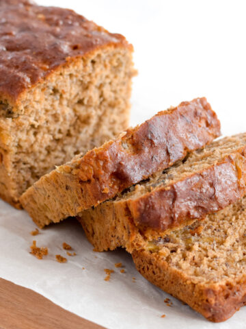 This one-bowl gluten-free banana bread recipe will be the best you've ever had. Super moist with no refined sugars and a dairy-free option, this healthy and delicious loaf is sure to be a hit!