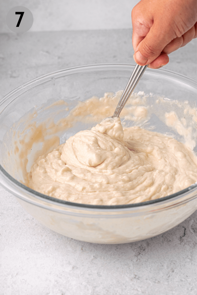 whisking gluten free focaccia dough with a fork