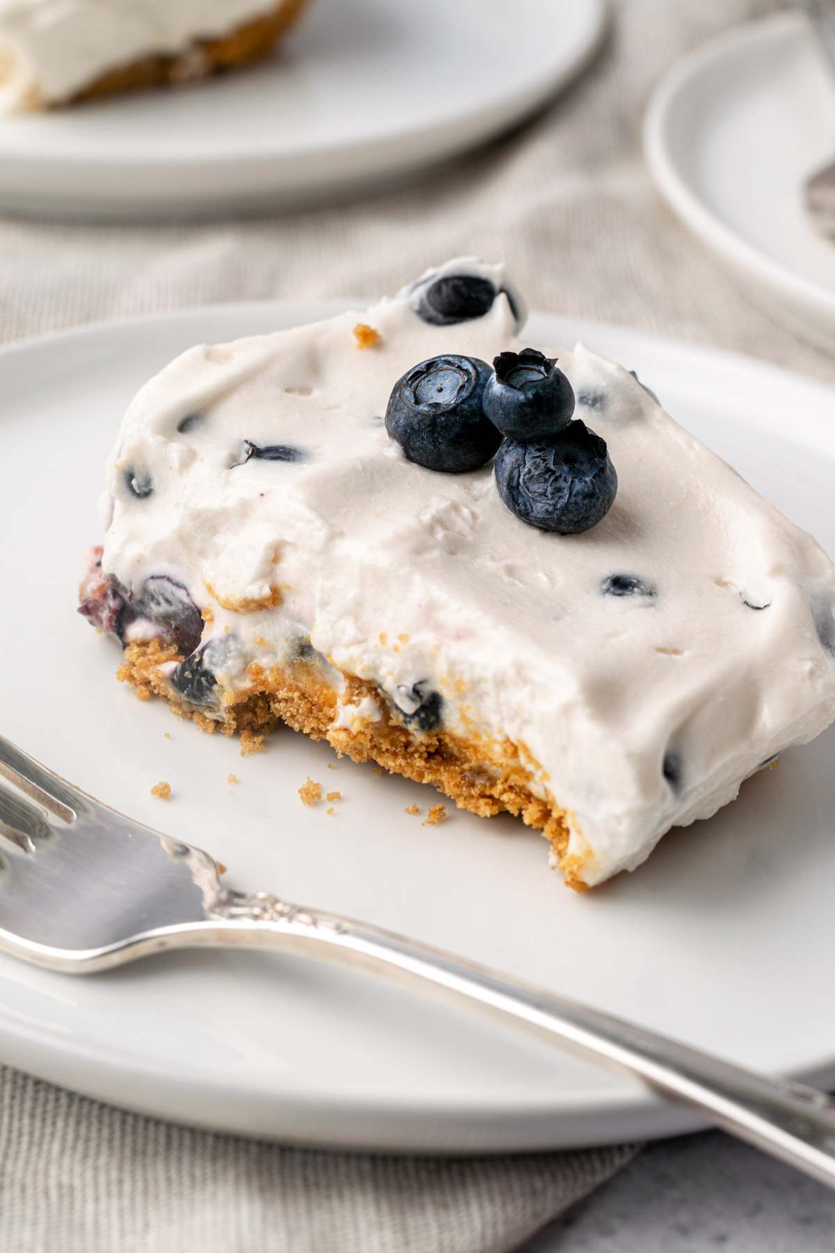 a slice of gluten free vegan blueberry cheesecake
