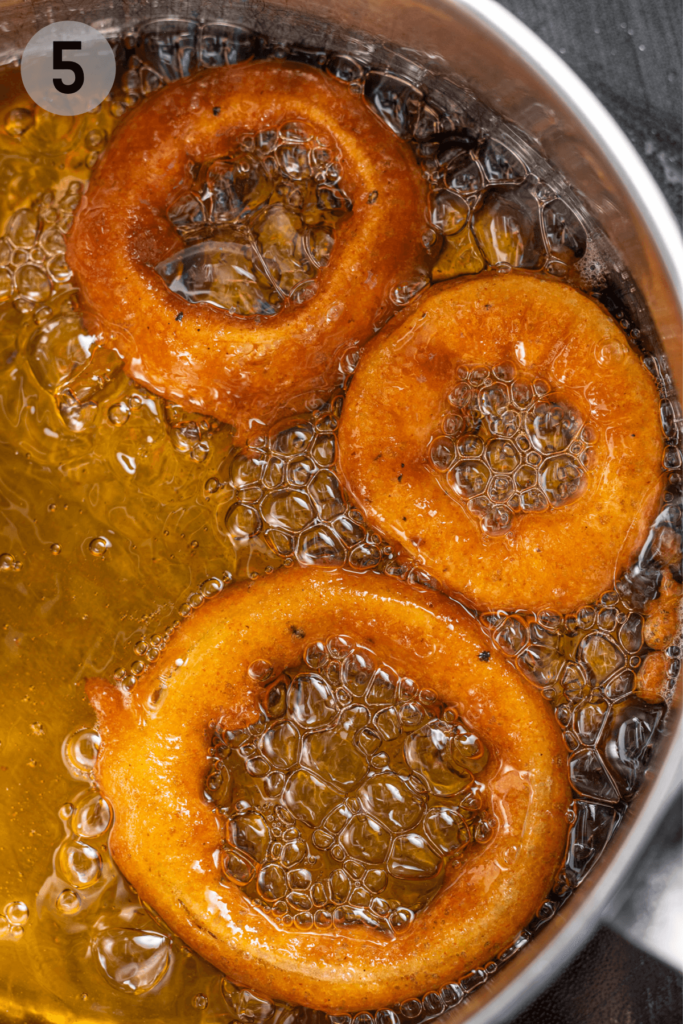 onion rings being fried