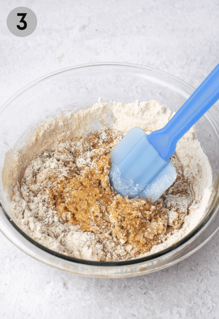 combining wet and dry ingredients for cookie dough