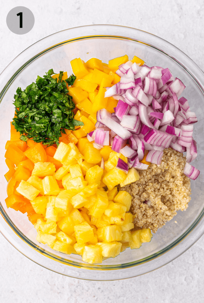 Mango Pineapple Quinoa Salad ingredients in a bowl