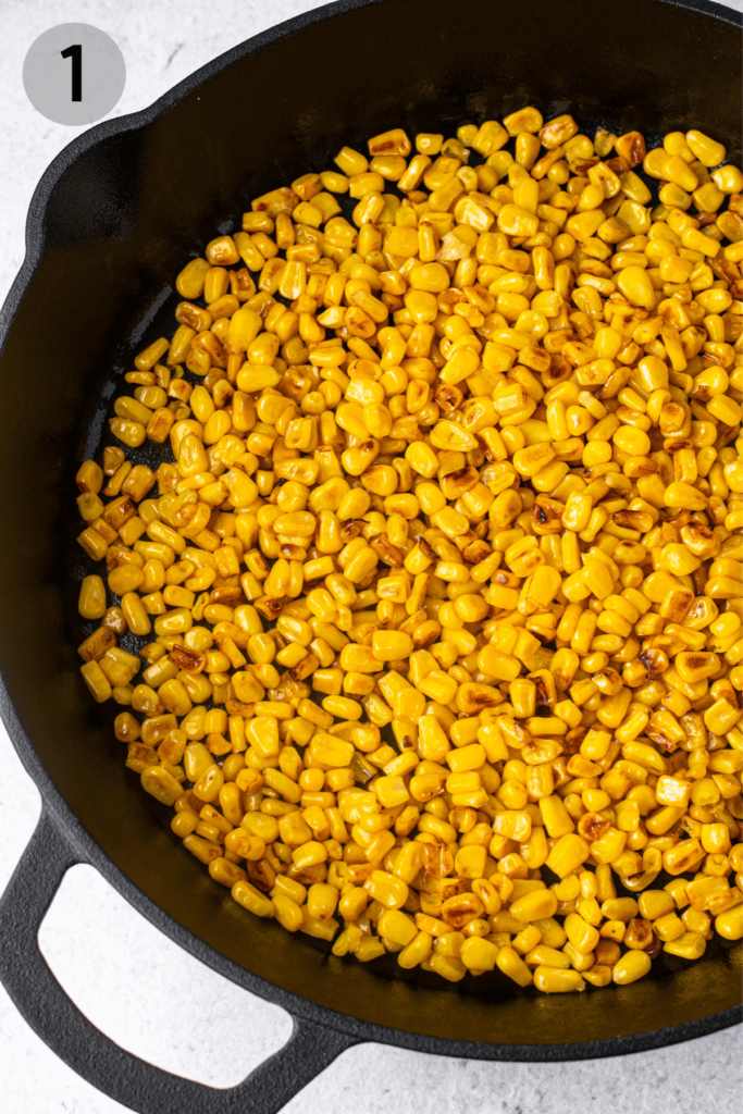 toasted corn in a cast iron skillet