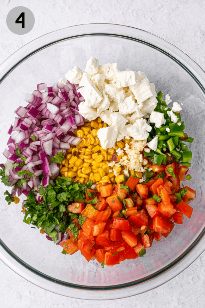 ingredients for mexican street corn salad in a bowl
