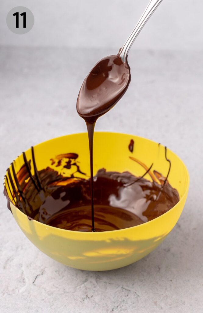 melted chocolate falling off a spoon