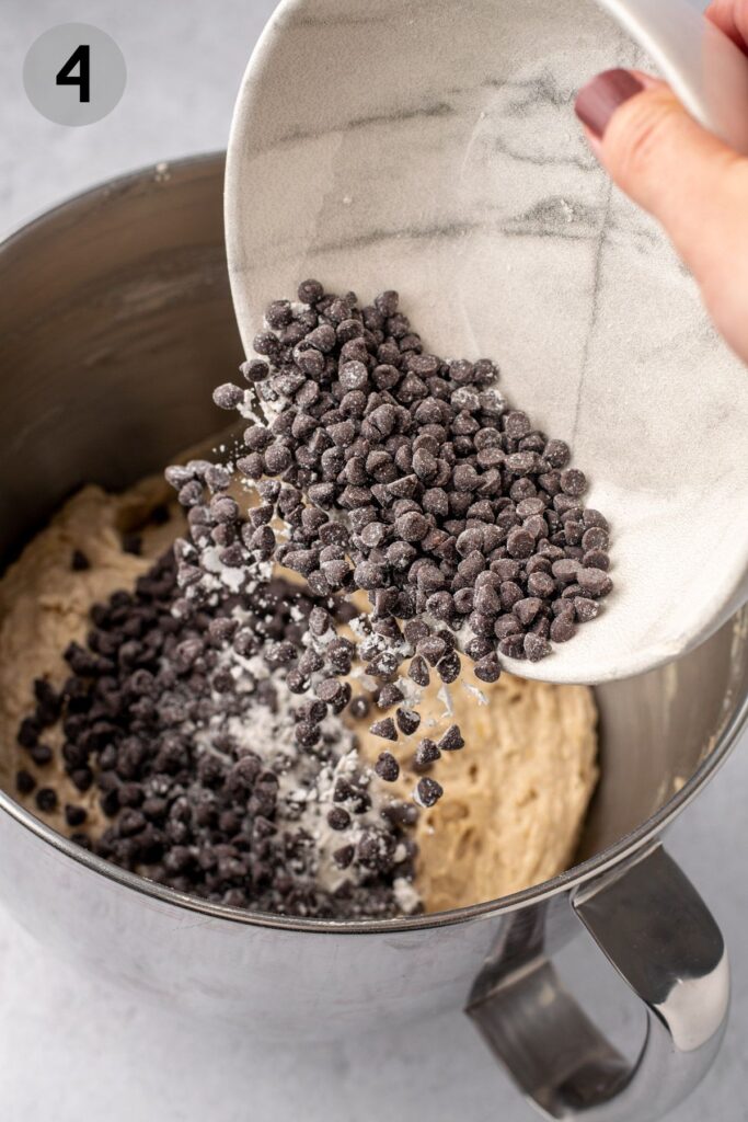 mini chocolate chips falling into muffin batter