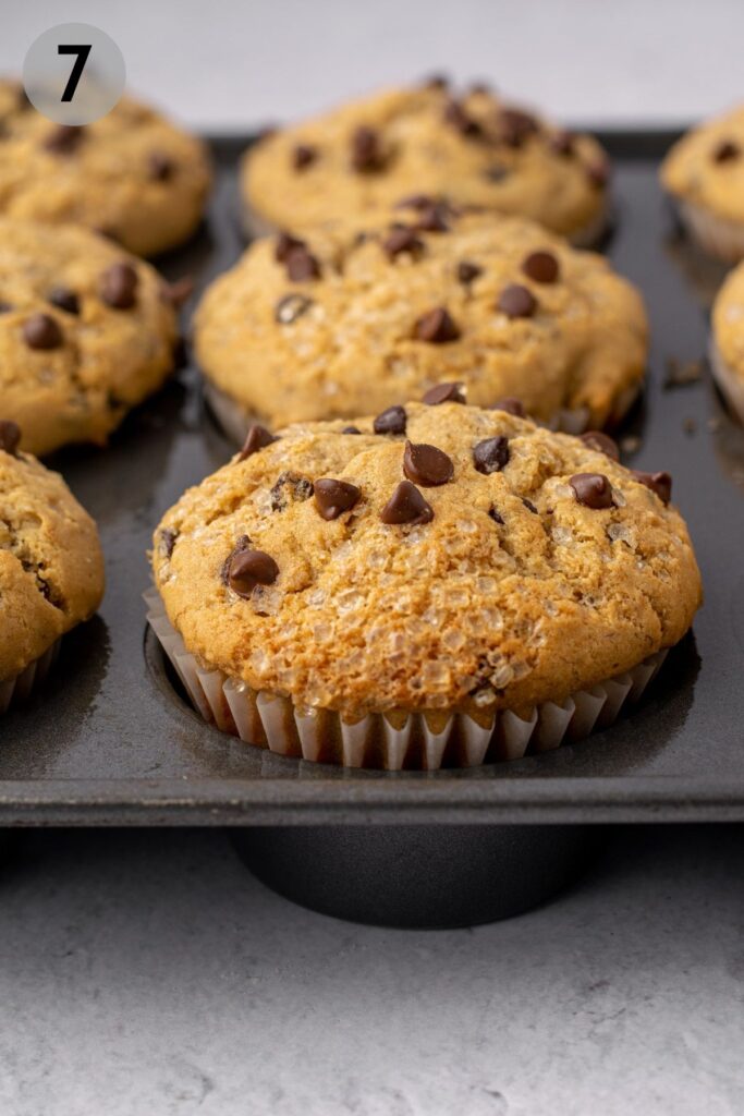 baked banana chocolate chip muffin in a tin