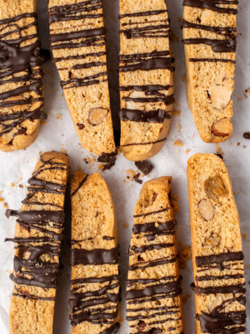 close up of almond biscotti drizzled with chocolate