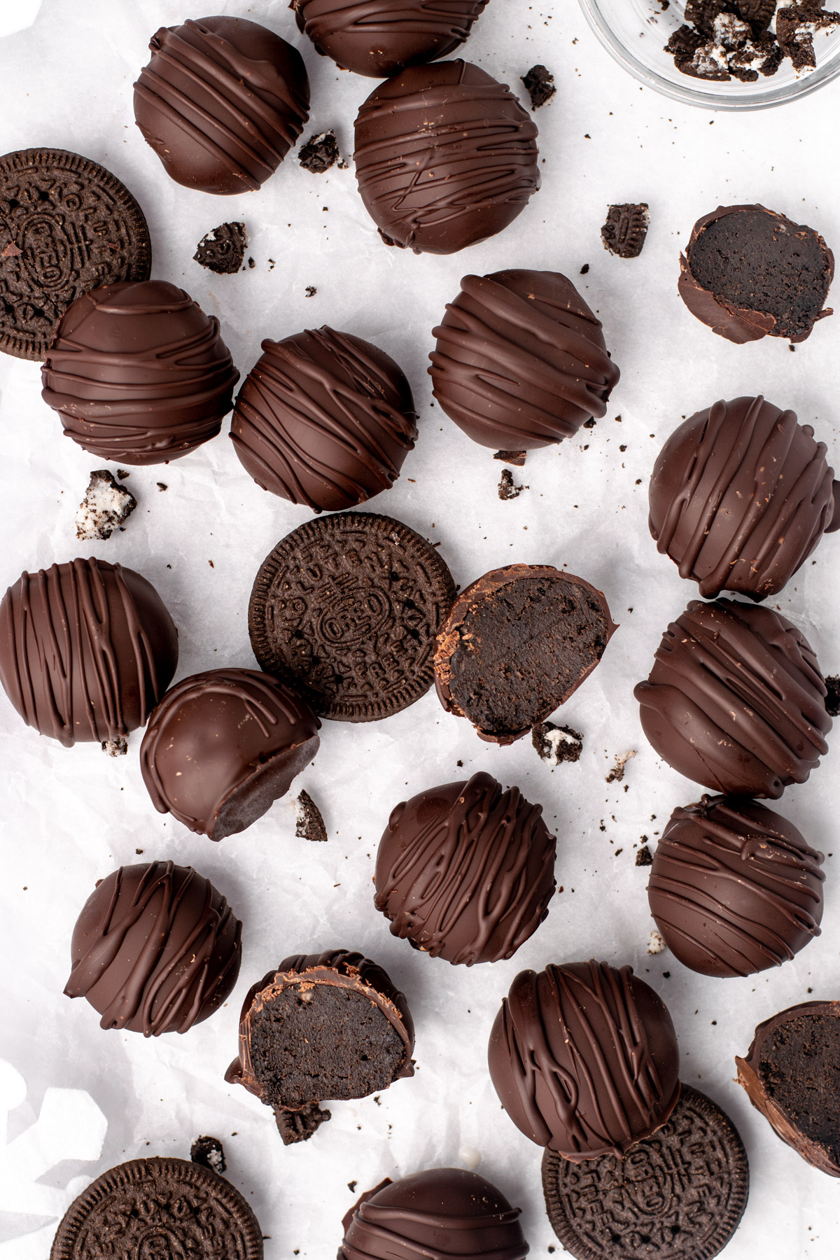 scattered gluten free oreo truffles with oreo cookie crumbs