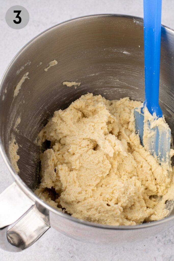 sugar cookie dough in a bowl with a spatula