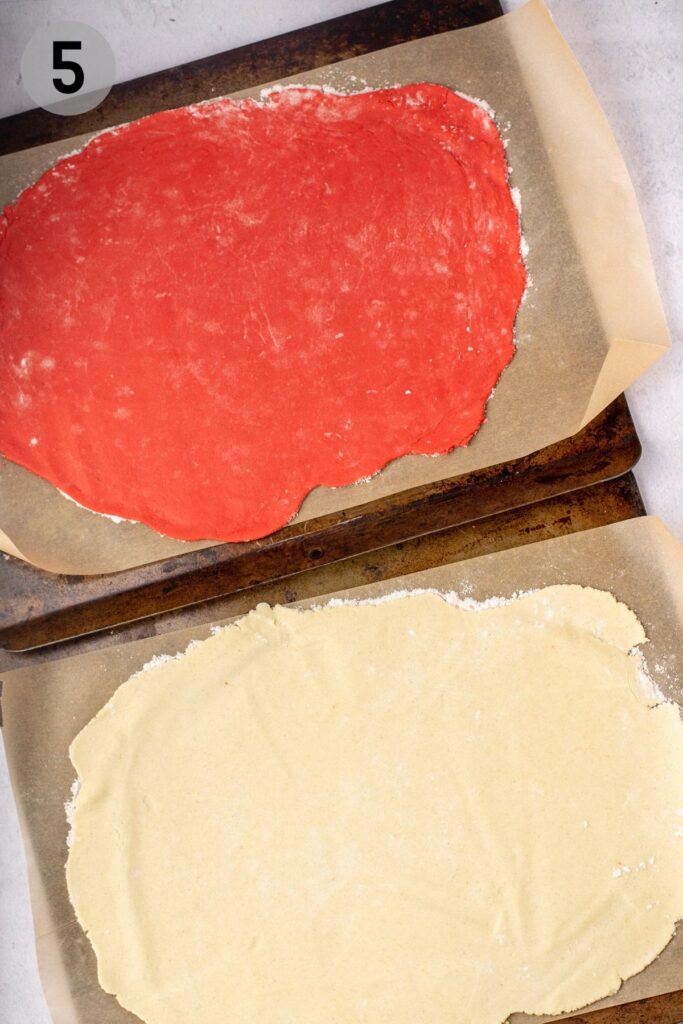 red and white sugar cookie dough rolled out