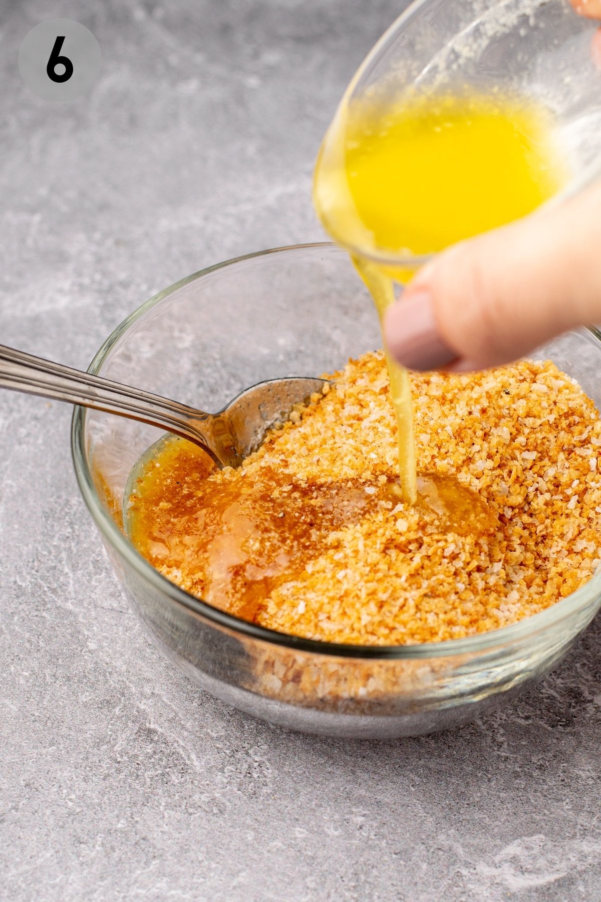 melted butter pouring into gluten free breadcrumbs