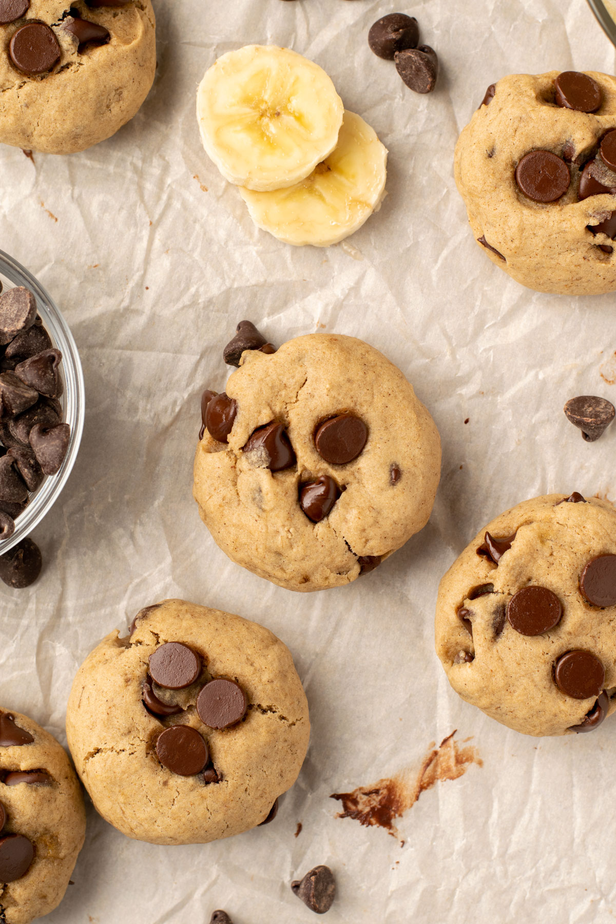 banana chocolate chip cookies on parchment paper
